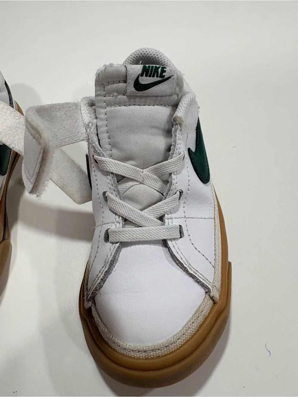 Nike Kids White Sneakers with Green Swoosh and Gum Sole